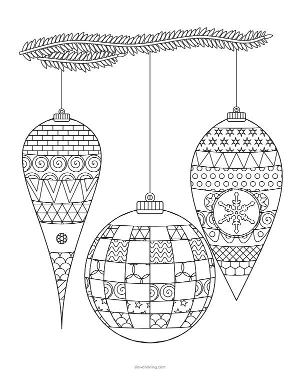 Three finely patterned ornaments hanging from a pine branch