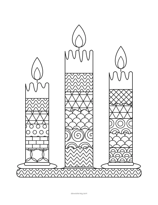 Three tall candles with patterned bands and a holly sprig at the base