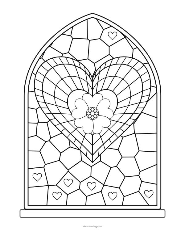 Pointed stained glass window with many small panes, a heart of radial panes and a heart flower